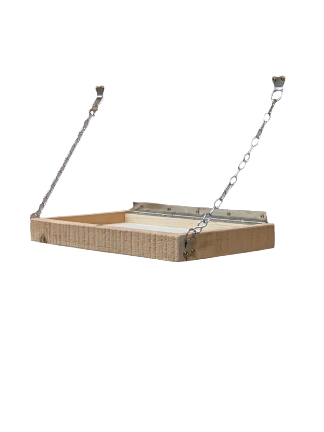 An adjustable Ellie Shelf mounted on a wall, made of wood, positioned above a workbench in a workshop setting.