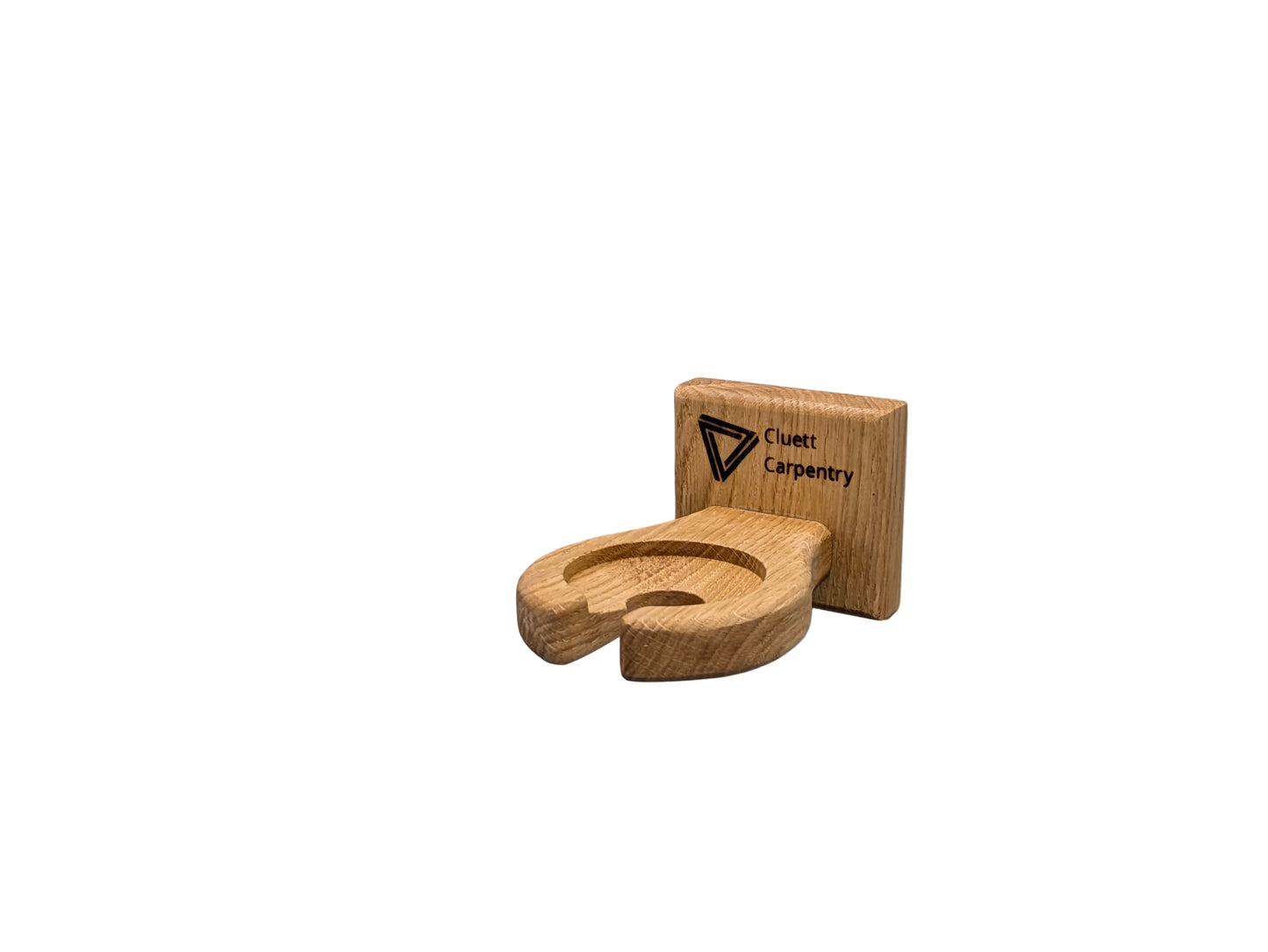 Wooden wineglass holder with a brand logo on a white wall